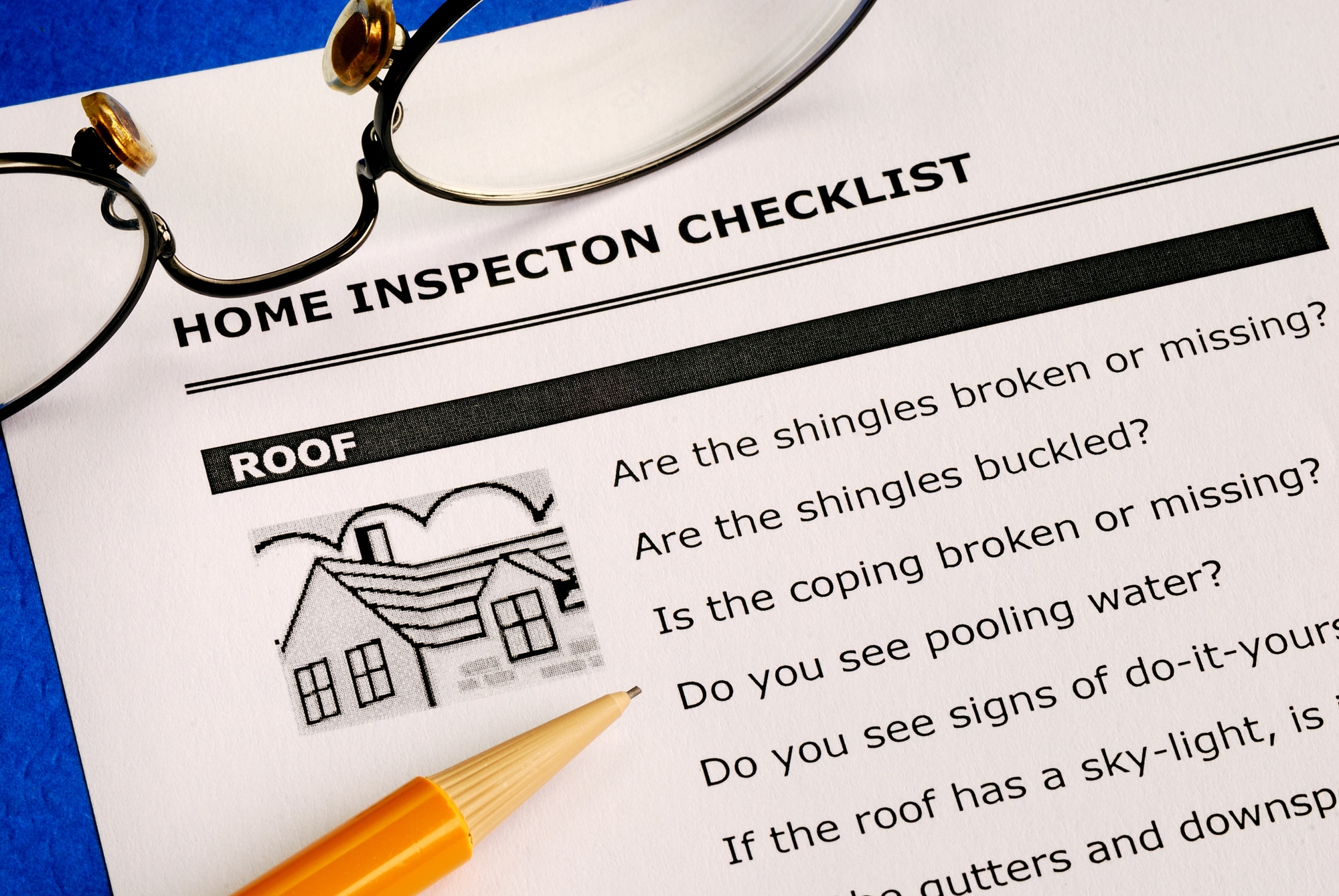 Home inspection checklist with pencil