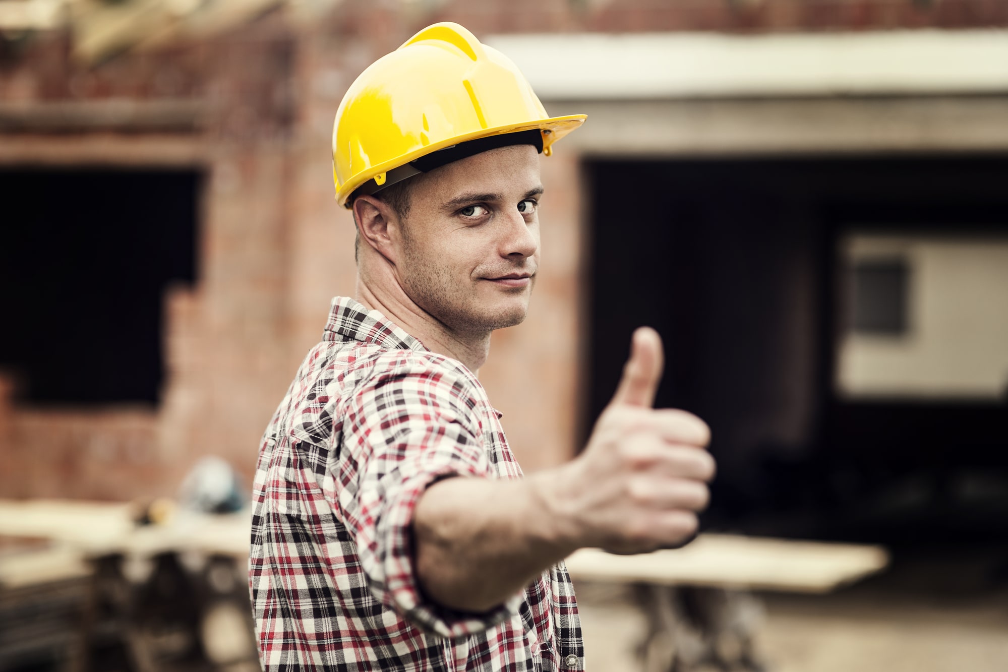 Man in hard hat giving thumbs up